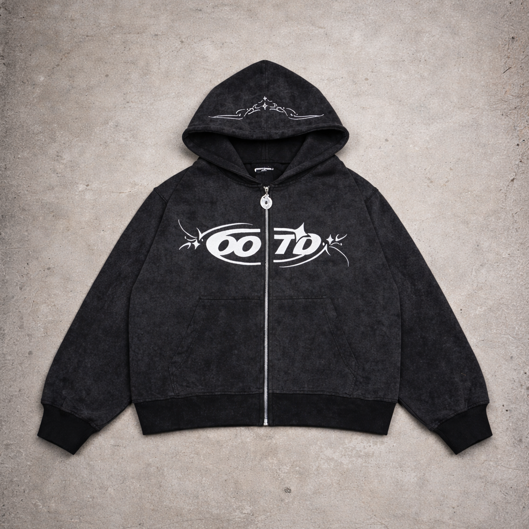 Black hoodie with white logo on a gray concrete surface