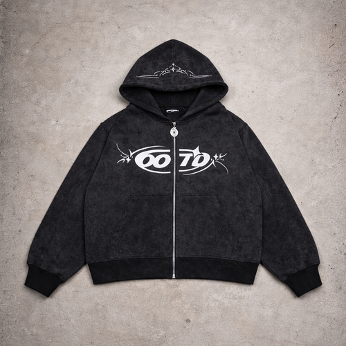 Black hoodie with white logo on a gray concrete surface